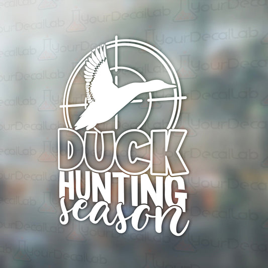 a duck hunting logo on a window