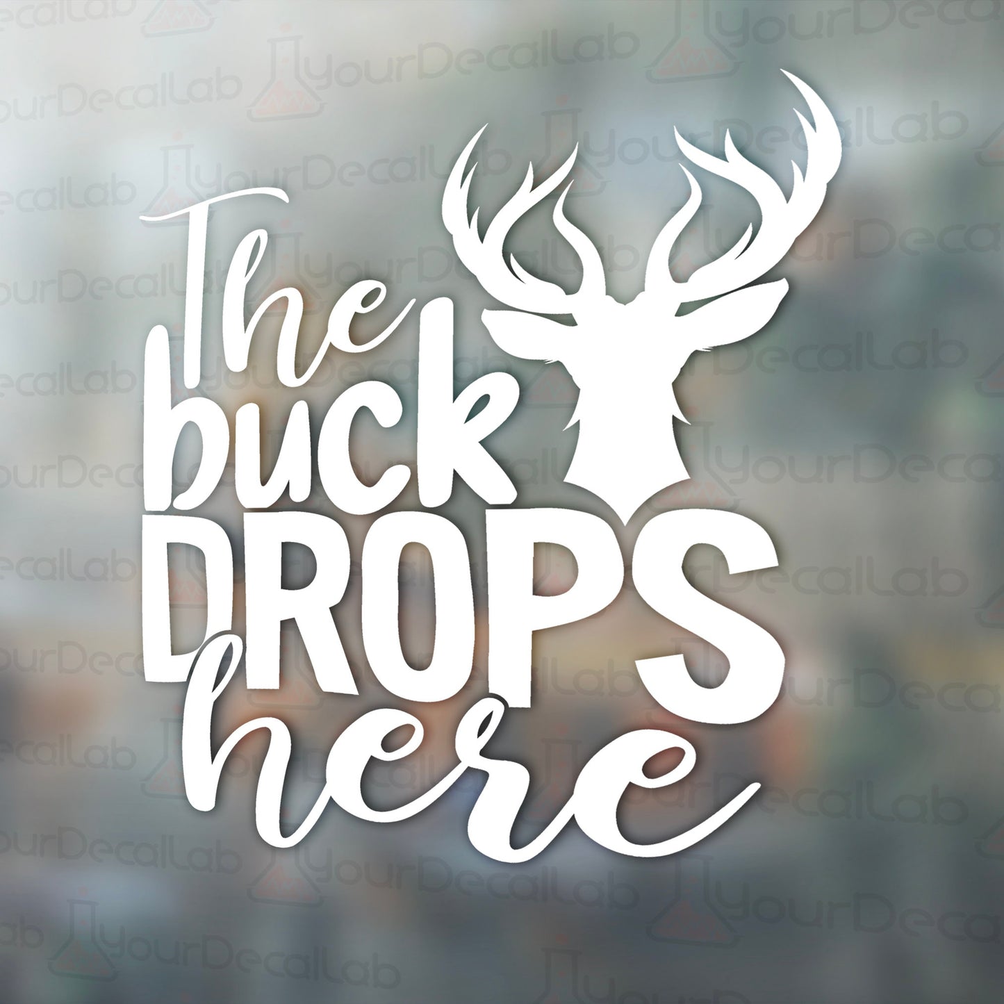 the buck drops here decal on a window