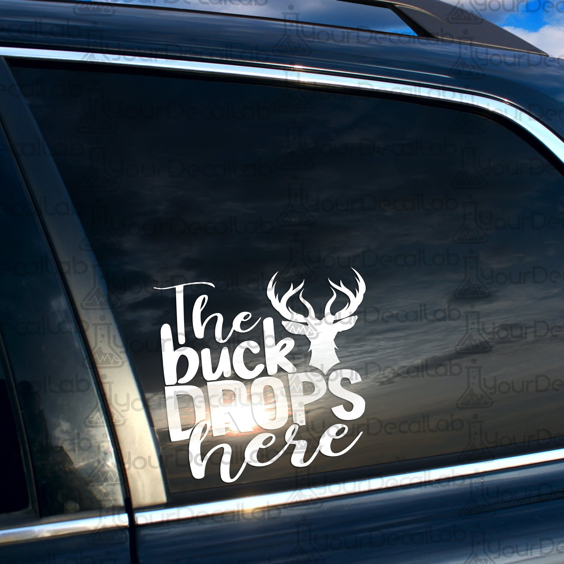 the buck drops here sticker on the back of a car