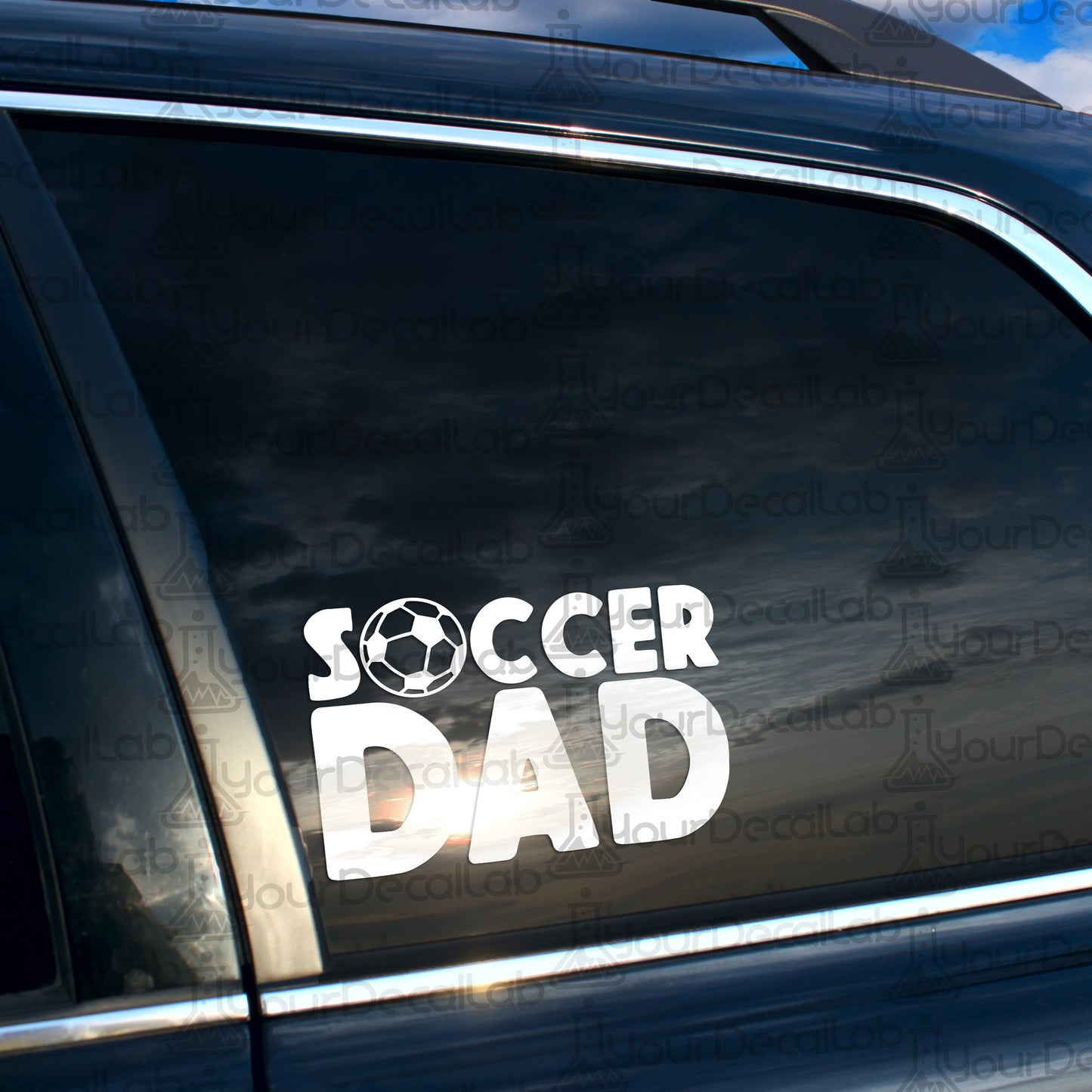 a car with a sticker that says soccer dad