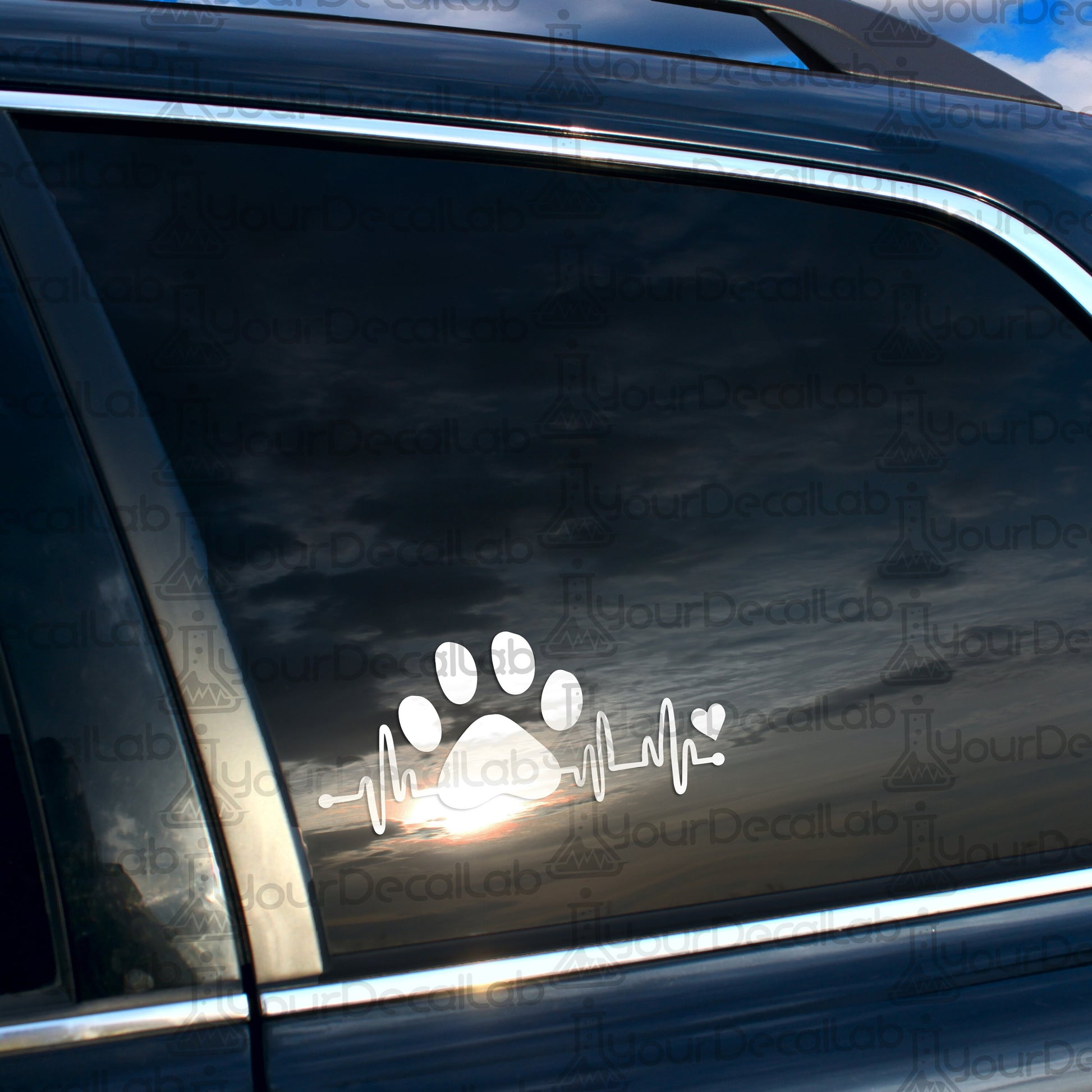 a car with a sticker of a dog&#39;s paw on it