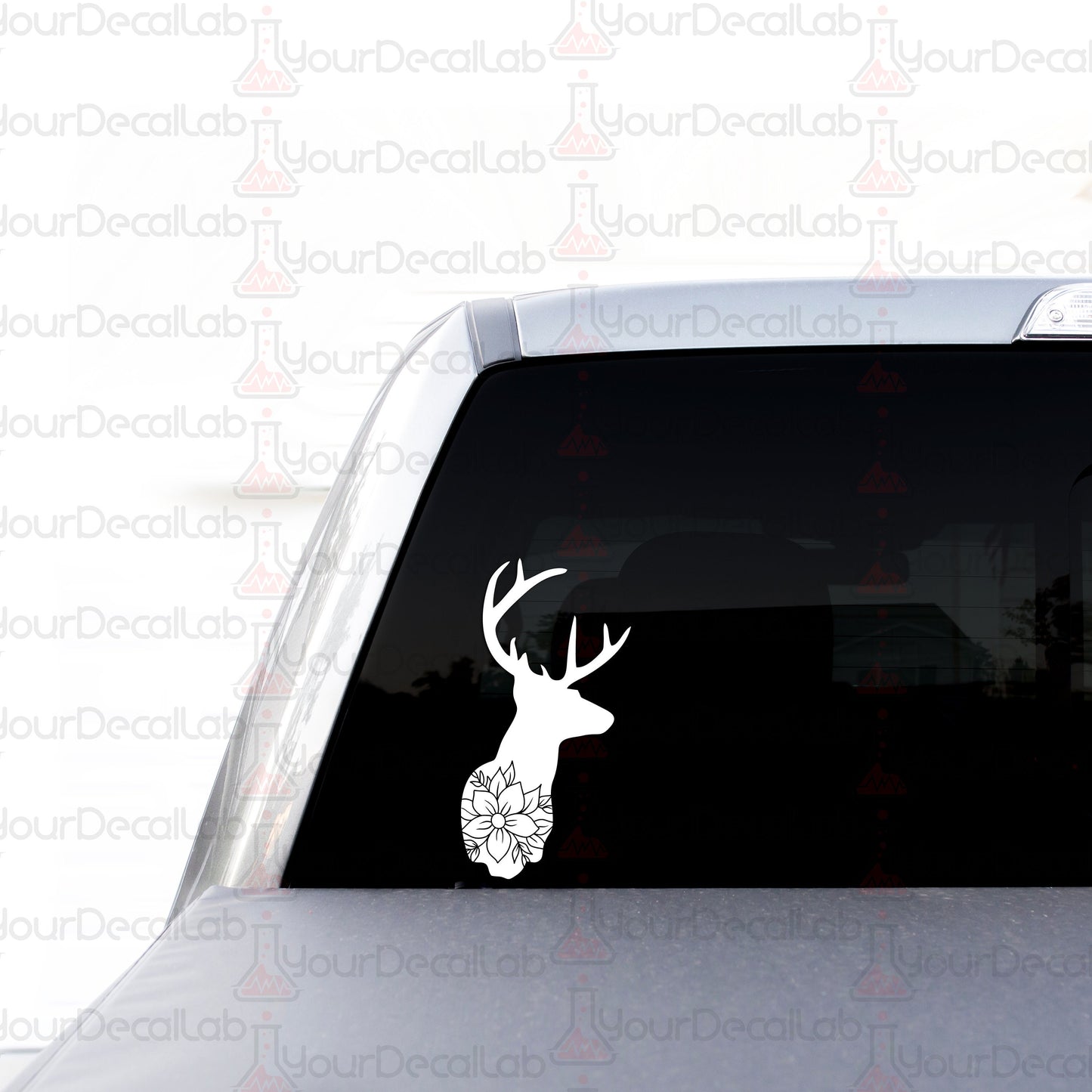 a car with a deer head decal on it
