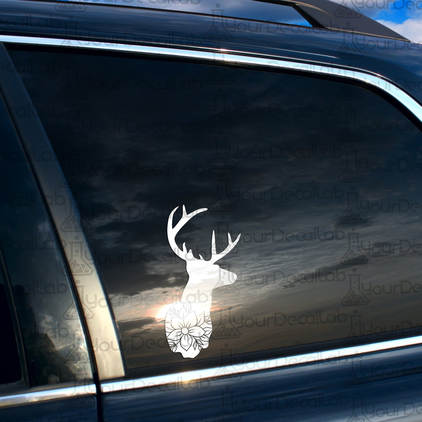 a car with a deer head decal on it