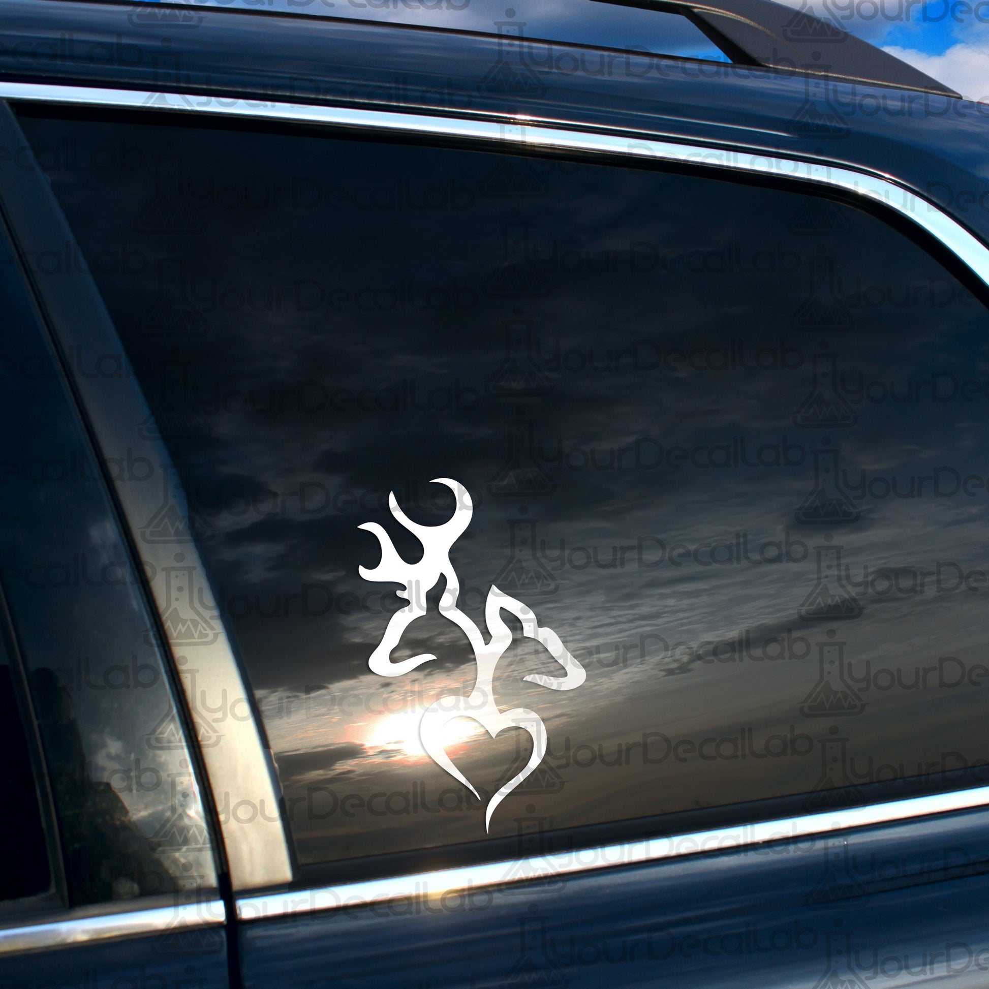 a sticker of a deer with a heart on it