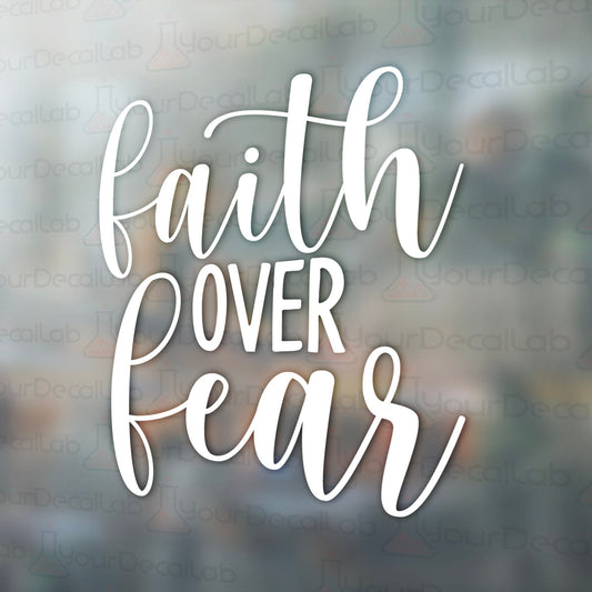 the words faith over fear on a glass background