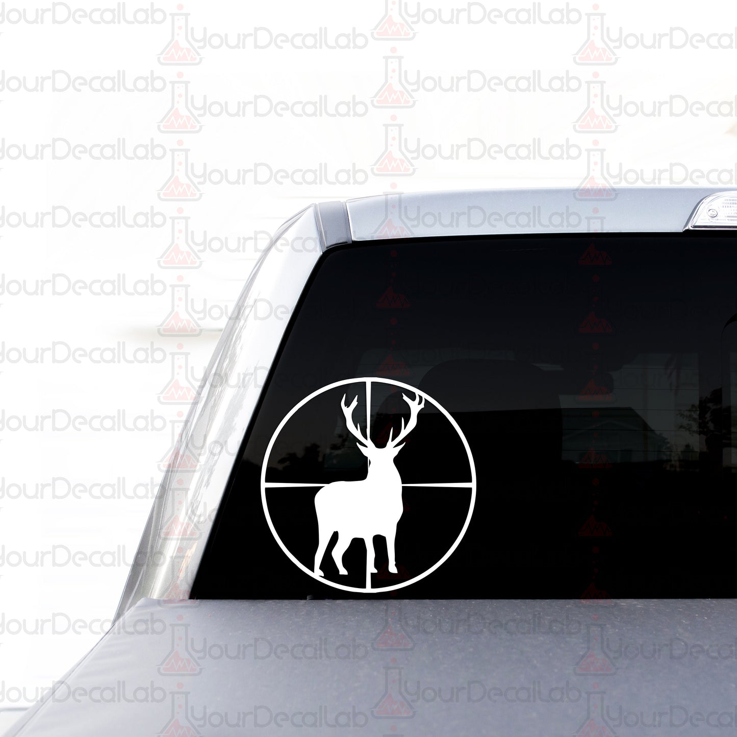 a sticker of a deer is shown on the back of a car