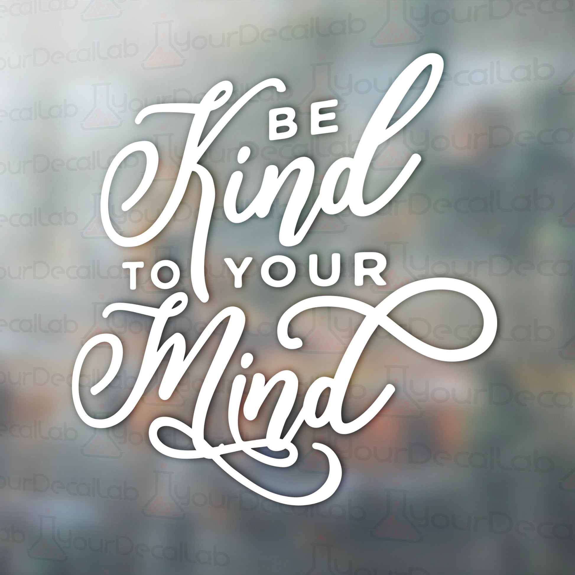 the words be kind to your mind on a blurry background