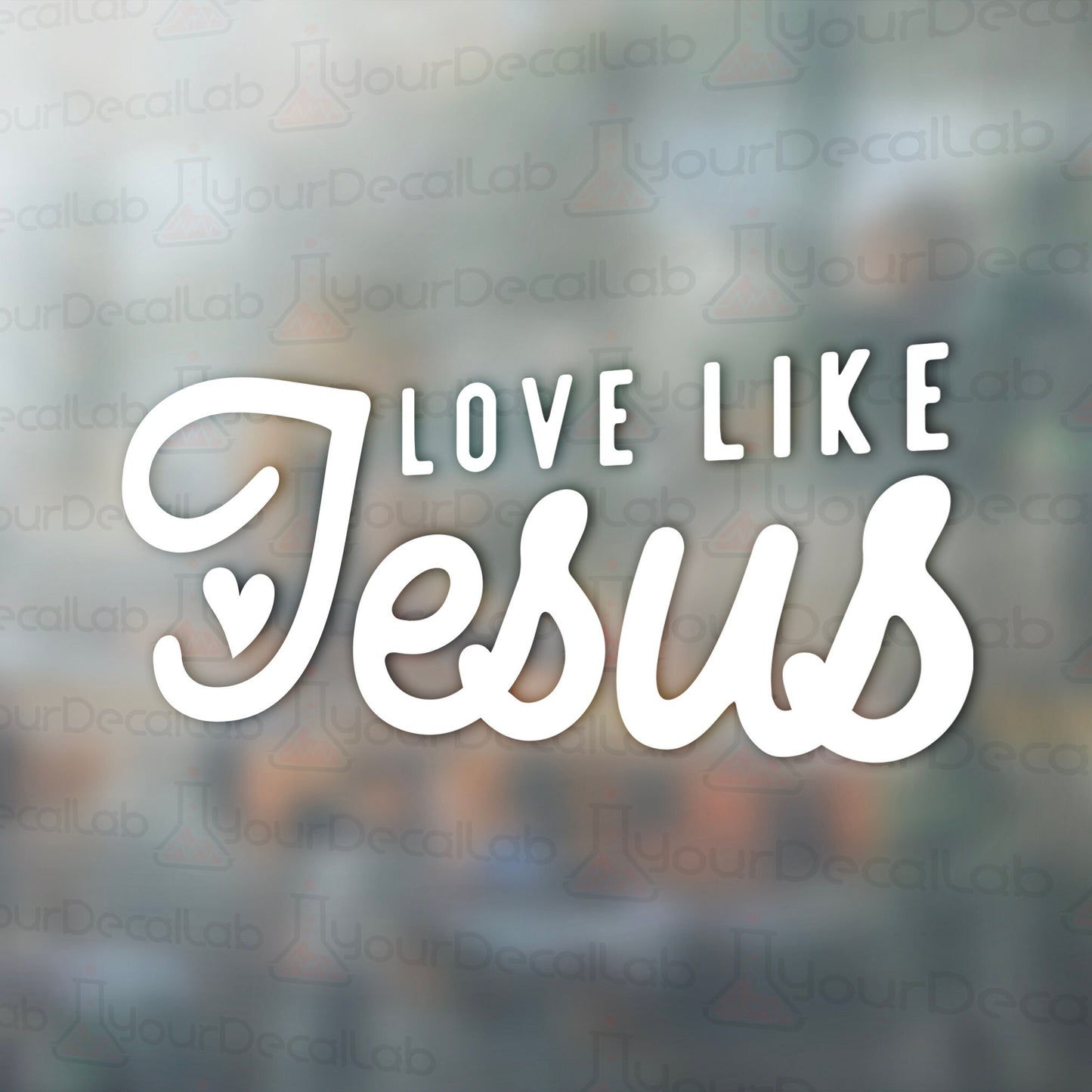 the words love like jesus on a blurred background