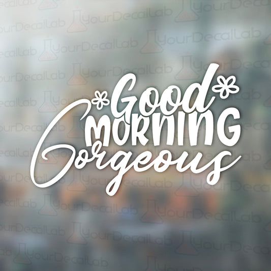 a window with the words good morning gorgeous on it