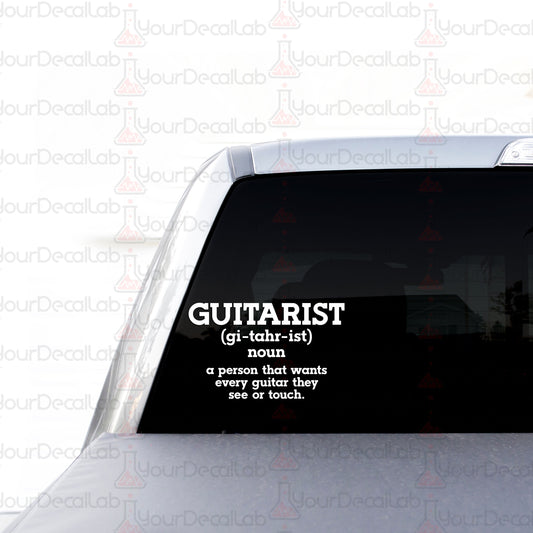 a sticker on the back of a car that says guitarist