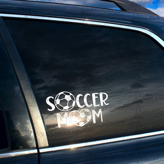 a soccer mom sticker on the side of a car
