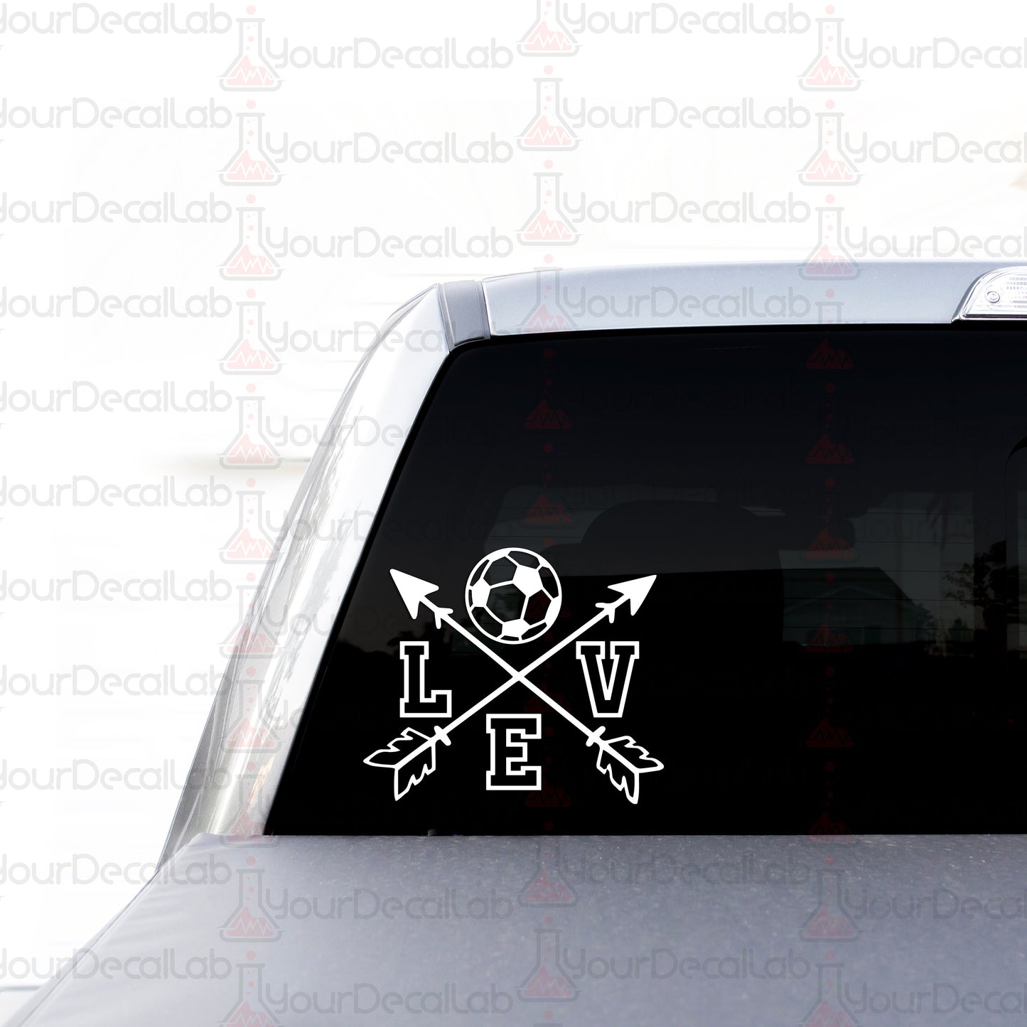 a car with a sticker of a soccer ball and arrows