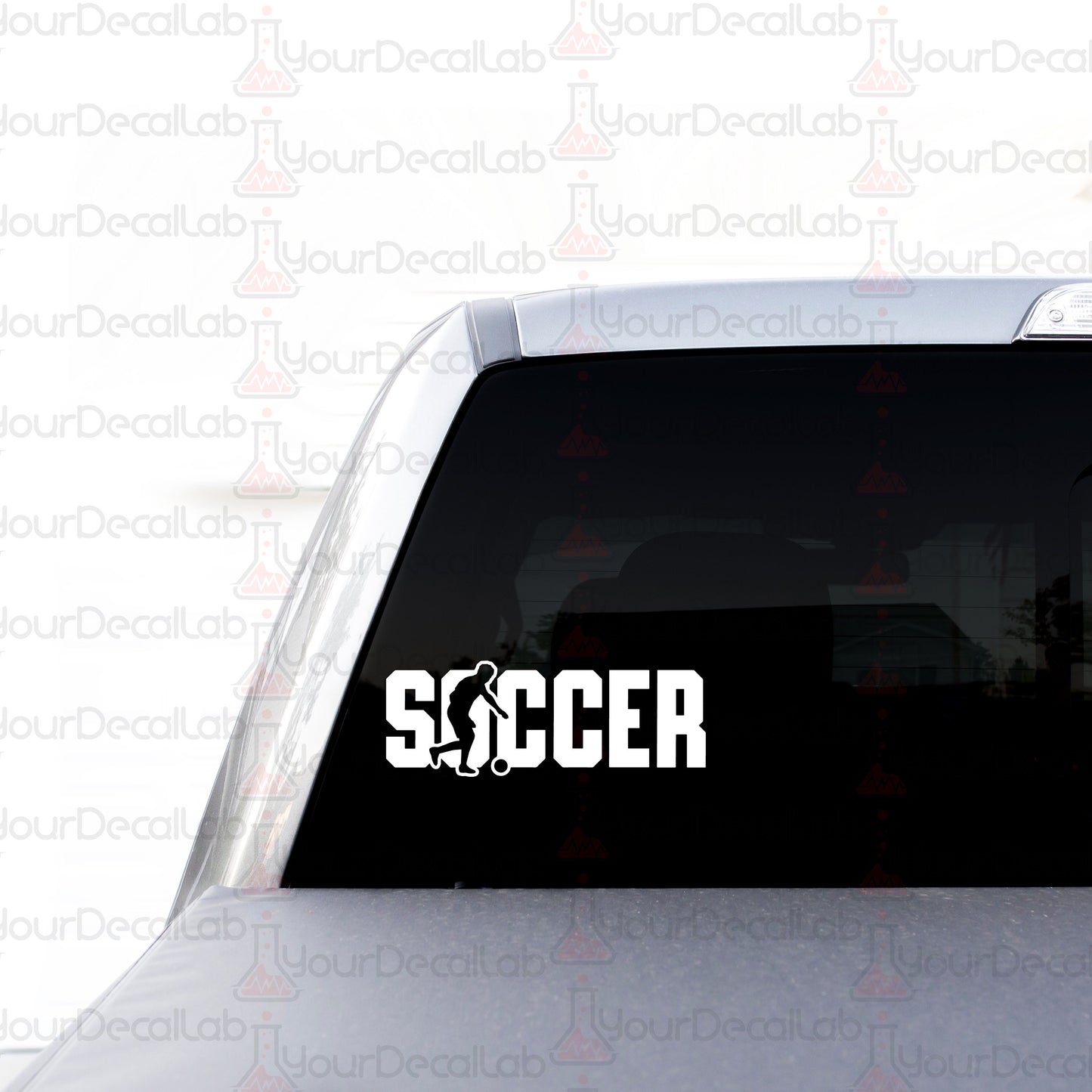 a sticker on the back of a car that says soccer