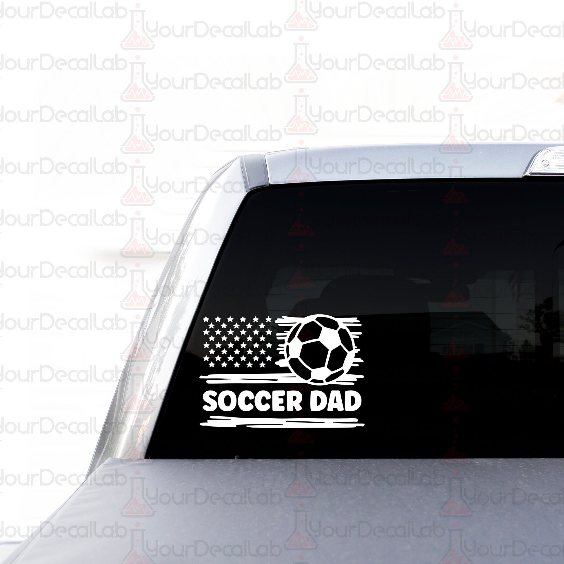 a soccer sticker on the back of a car