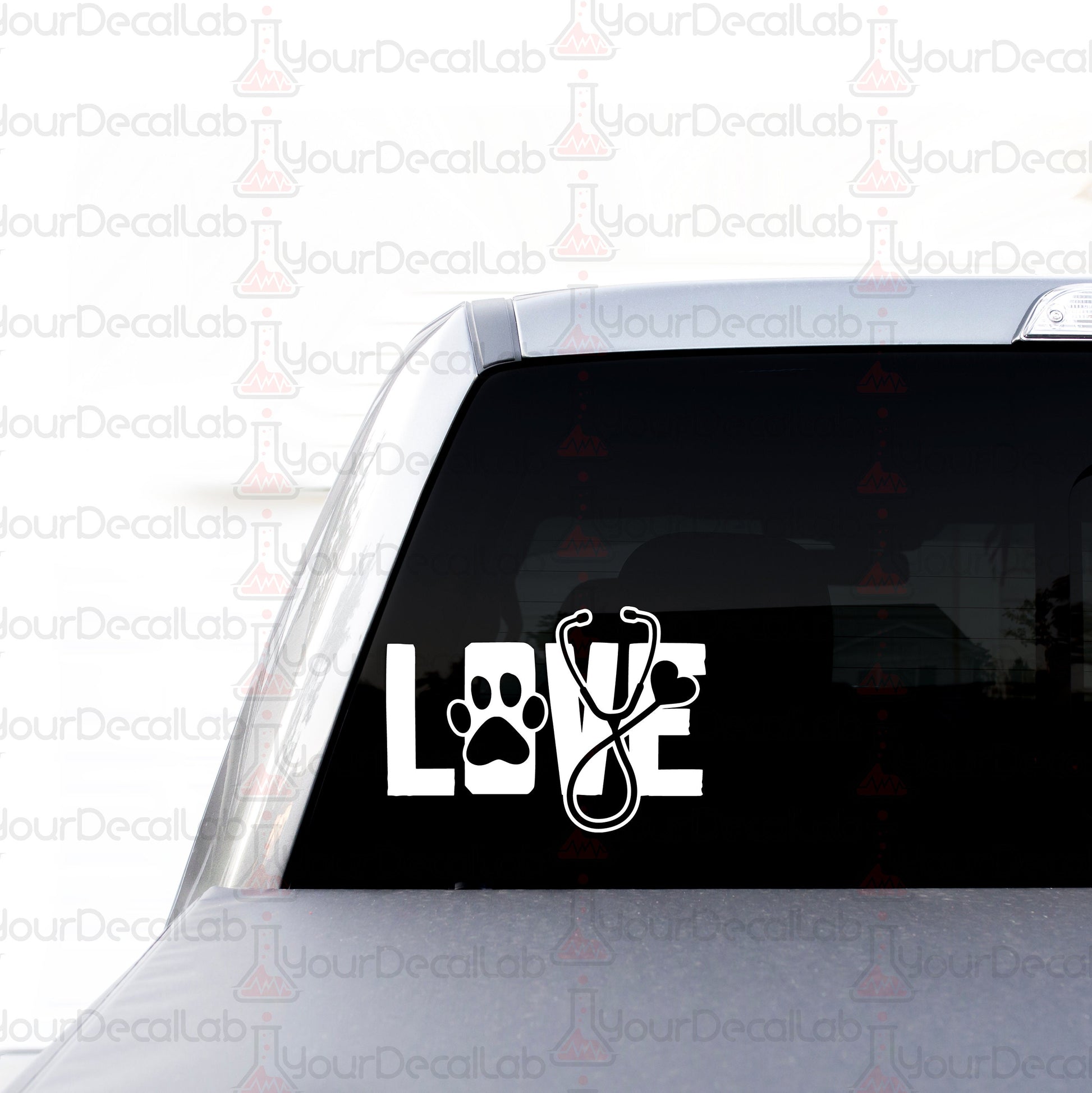 a car with a sticker of a dog paw and the word love on it