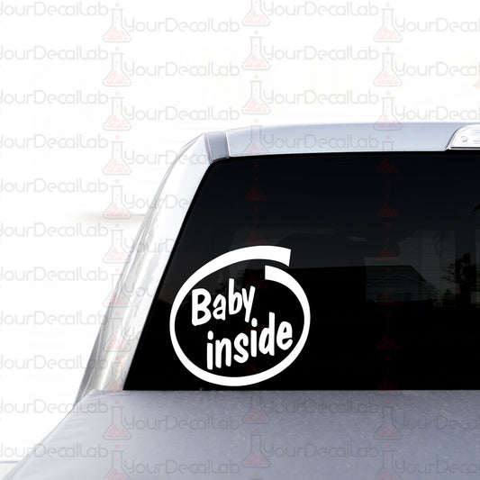 a baby inside sticker on the back of a car