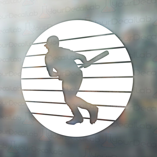a silhouette of a baseball player holding a bat