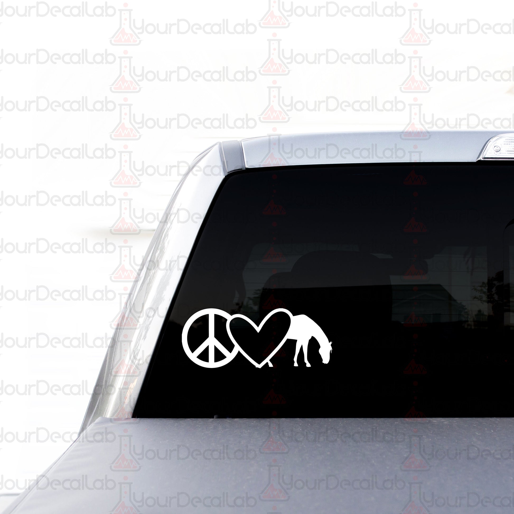 a car with a peace sign and a giraffe sticker on it