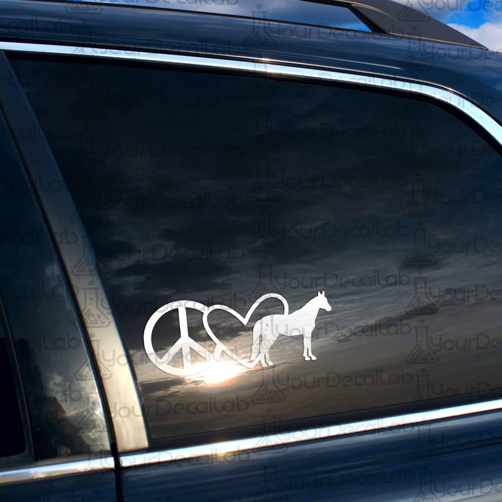 a car with a sticker of a horse and a peace sign