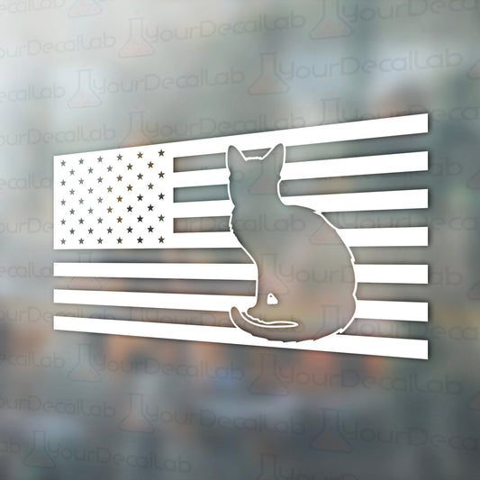 a sticker of a cat sitting on top of an american flag