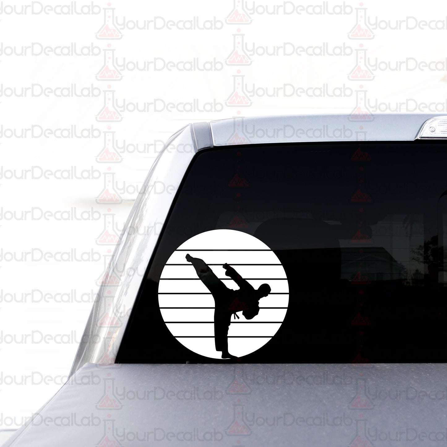 a sticker on the back of a car with a silhouette of a person doing