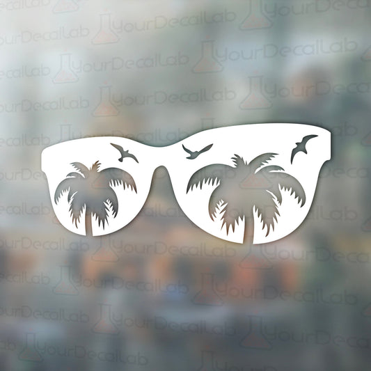 a pair of sunglasses with palm trees on them