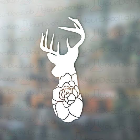 a deer&#39;s head with a flower on it