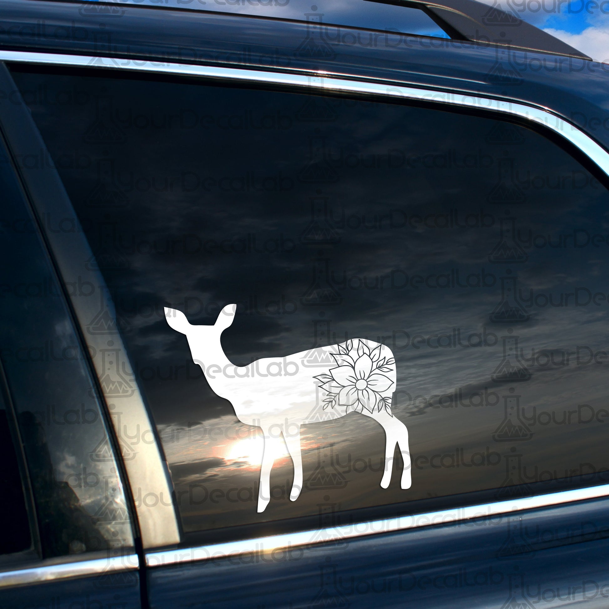 a car with a deer decal on the side of it