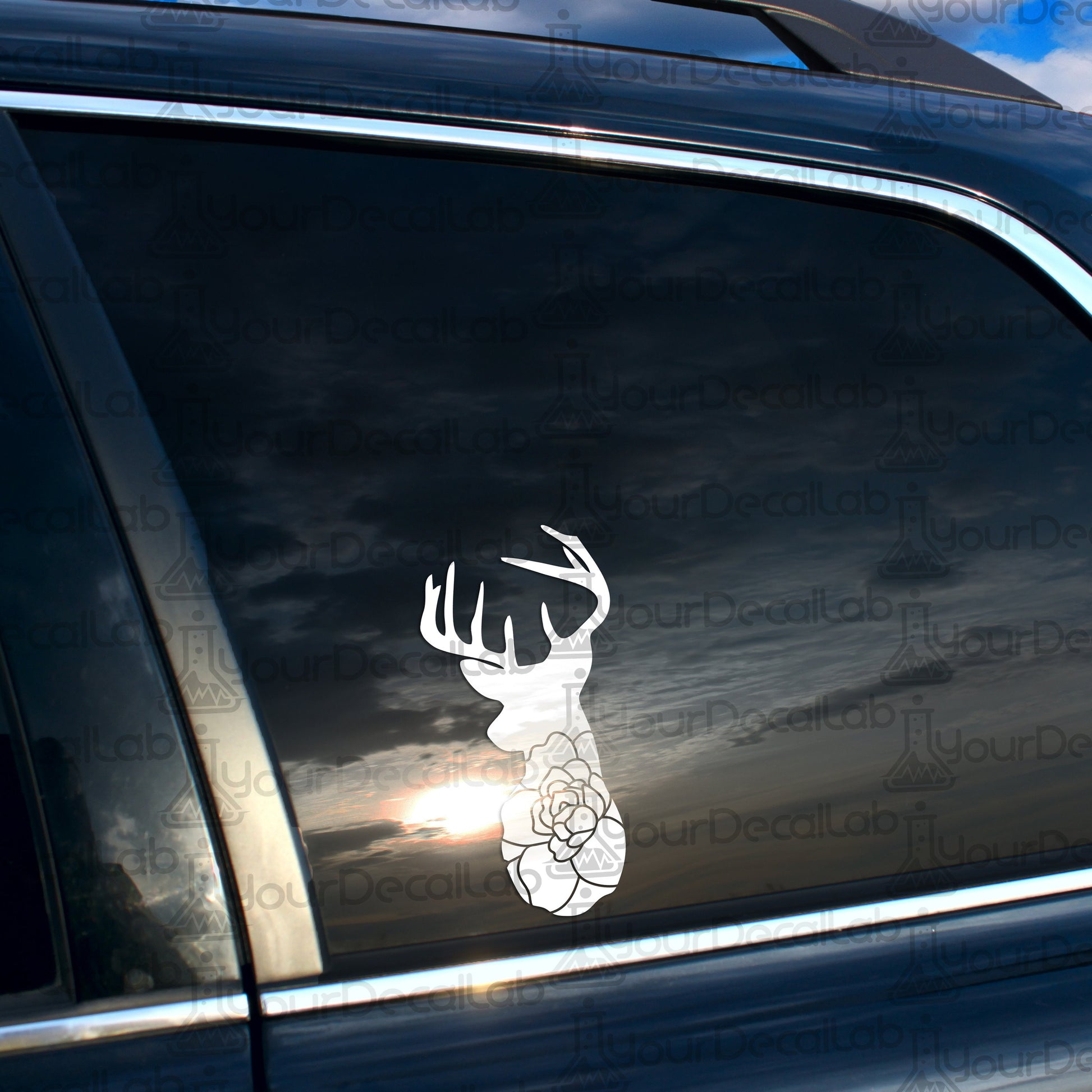 a car with a sticker of a deer&#39;s head