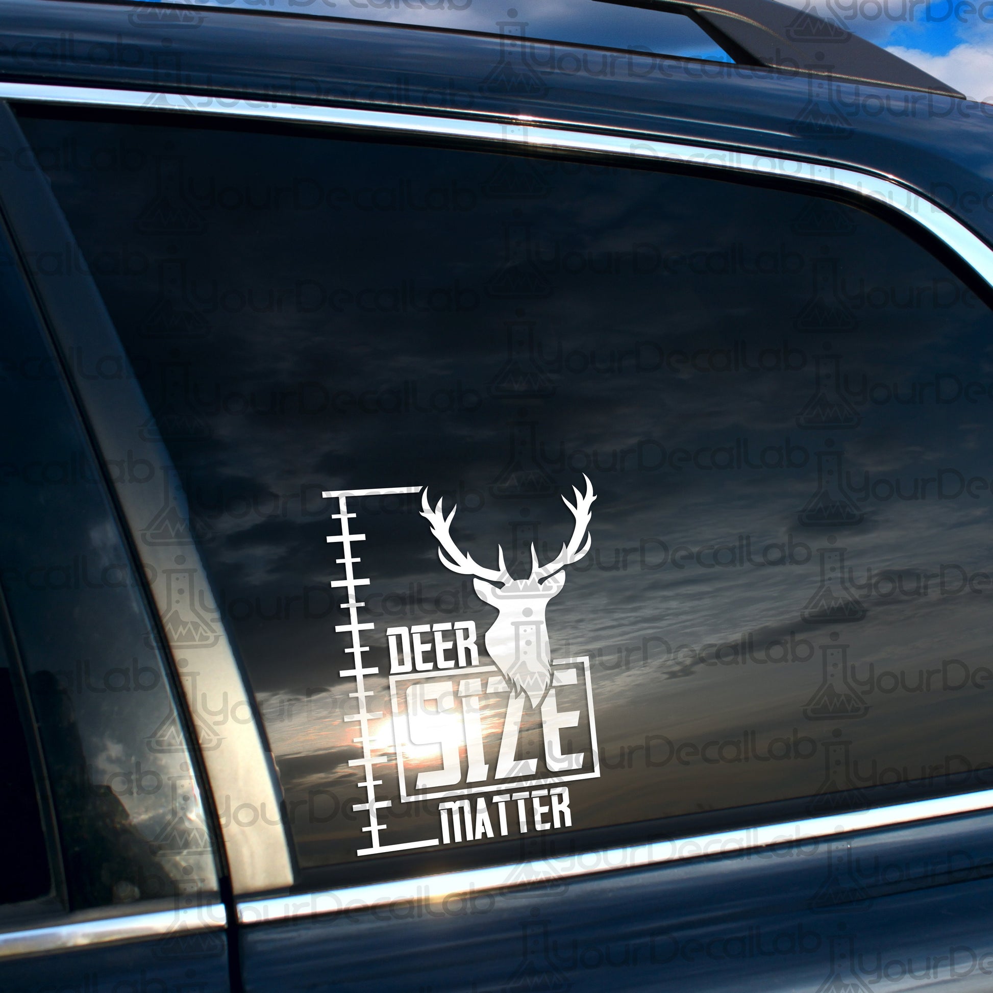 a deer decal on the side of a car