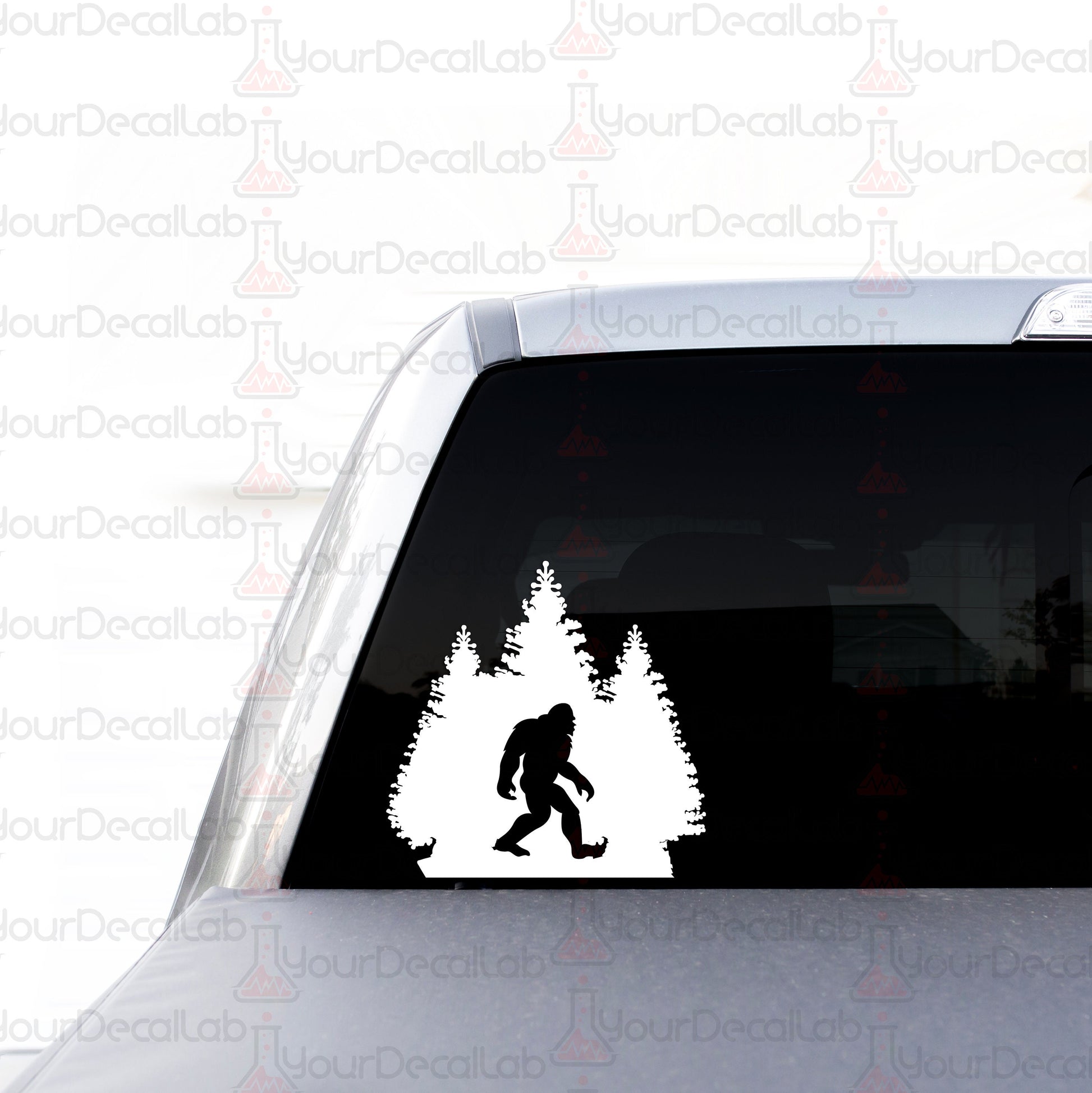 a bigfoot sticker on the back of a car