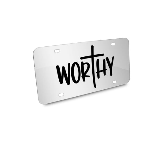 a white license plate with the word worthy written on it