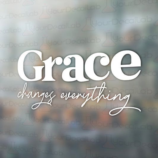 the words grace change everything on a blurry background