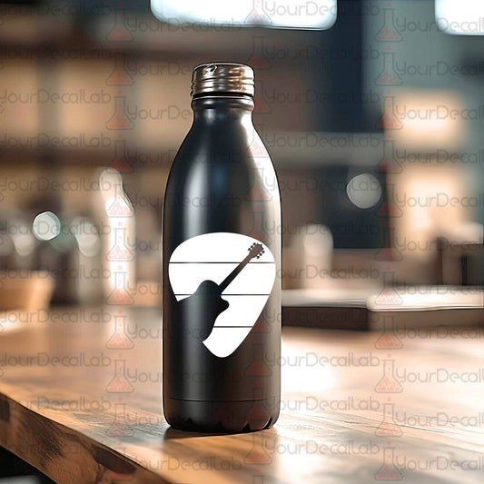 a black water bottle sitting on top of a wooden table