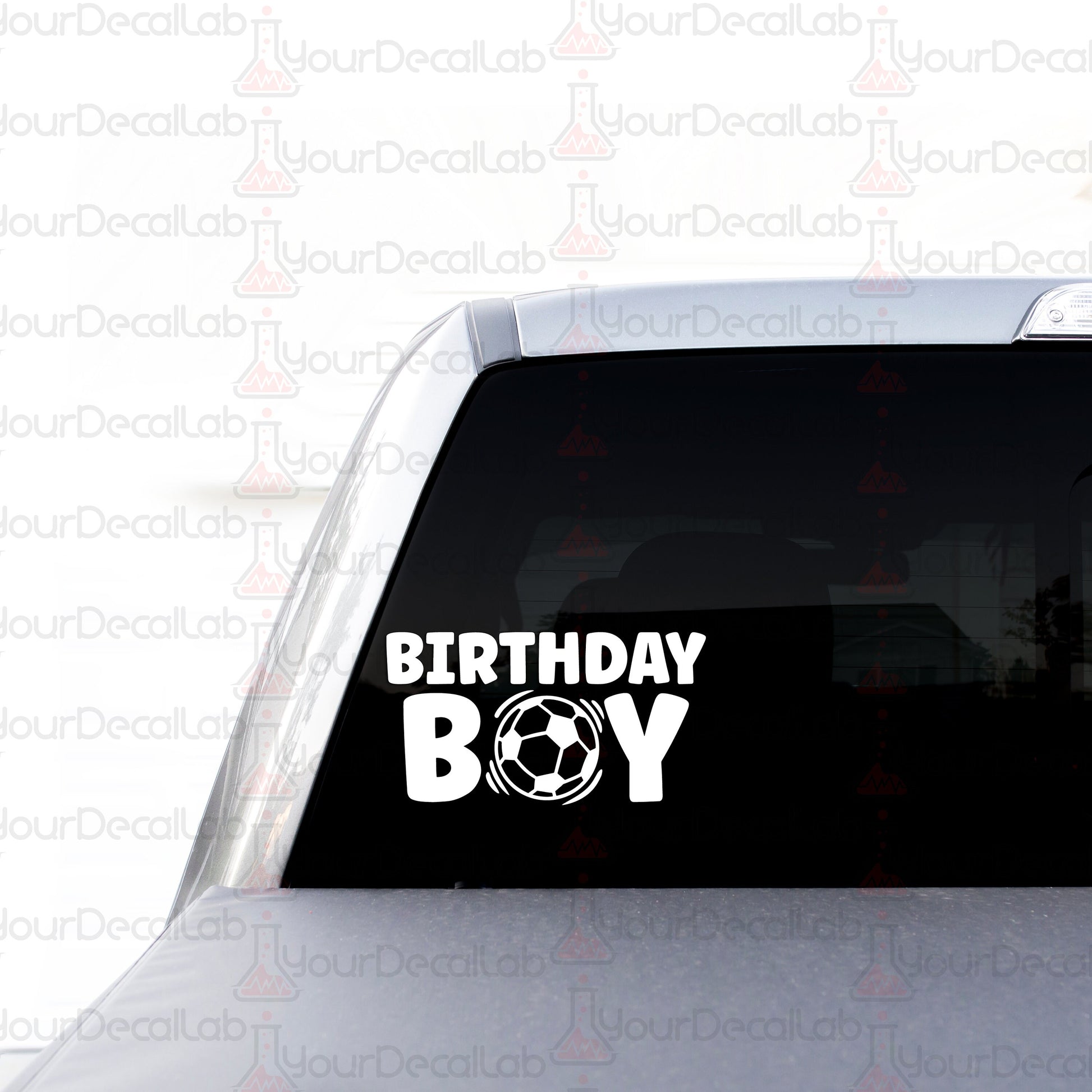 a birthday boy sticker on the back of a car