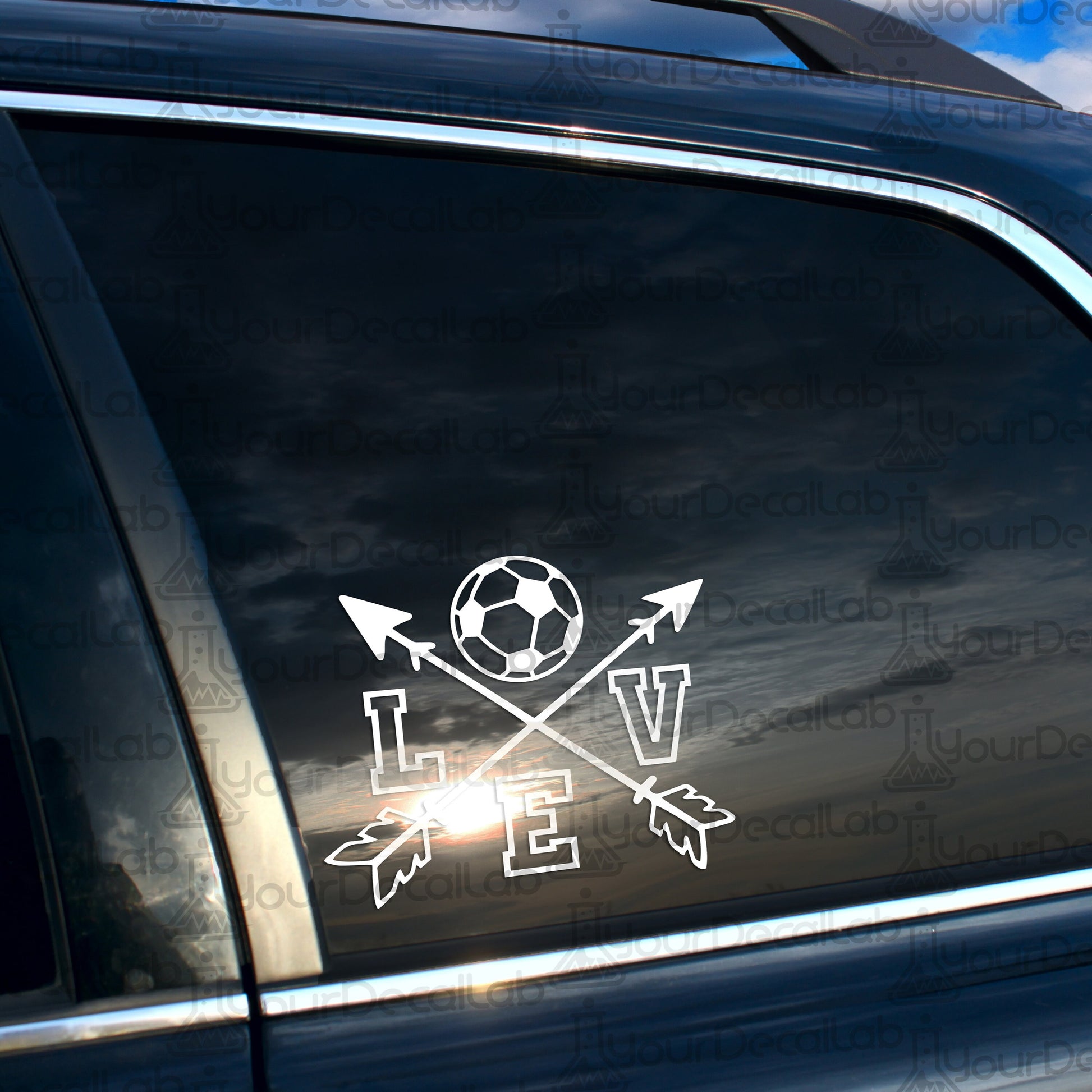 a car with a sticker of a soccer ball and arrows