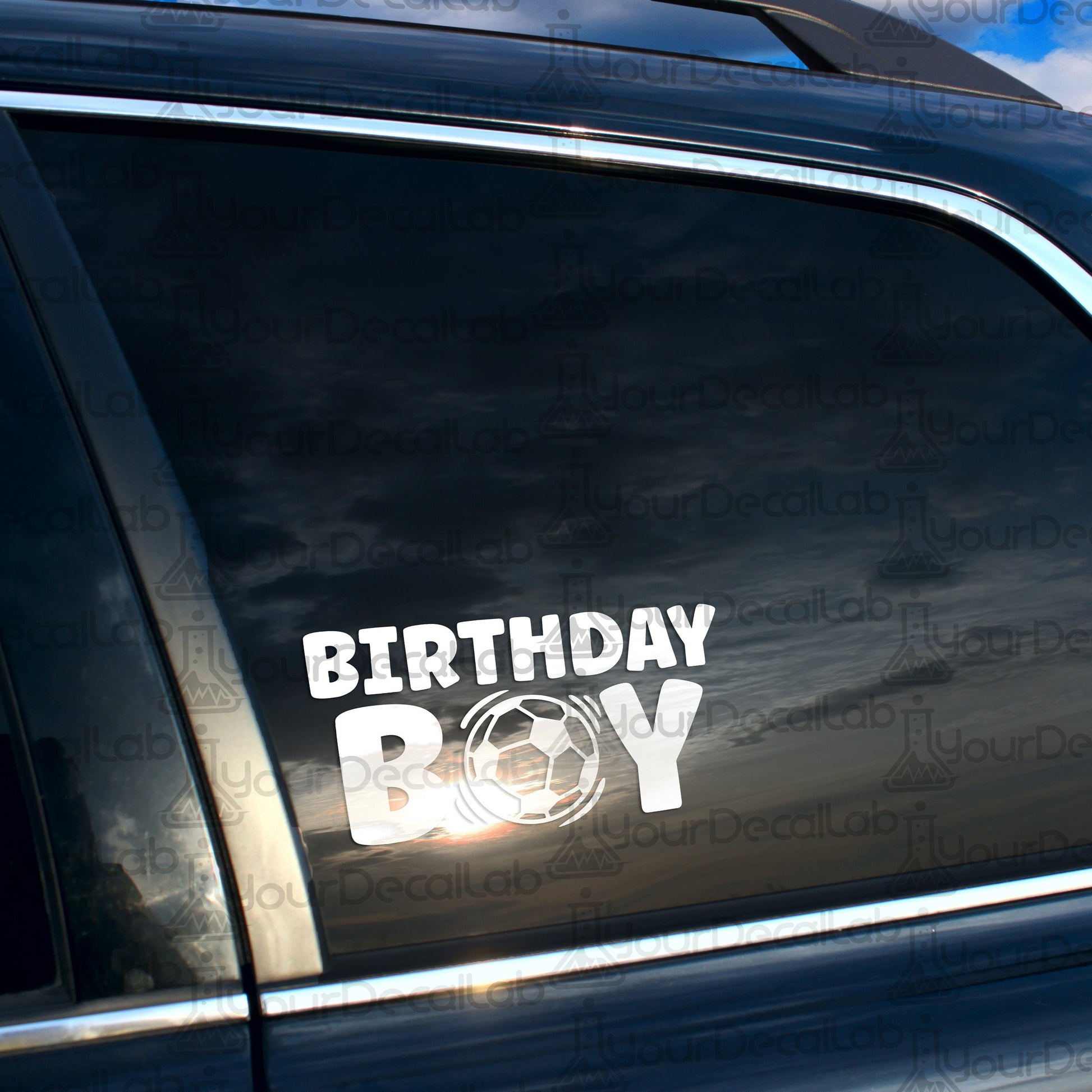 a car with a sticker that says birthday boy