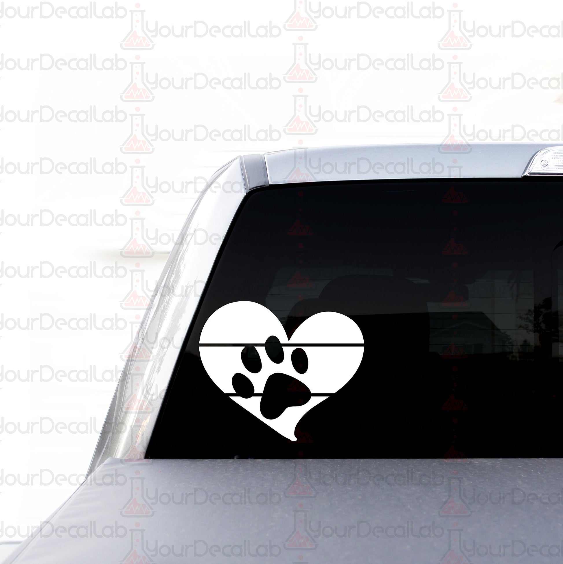 a car with a heart and paw prints on it