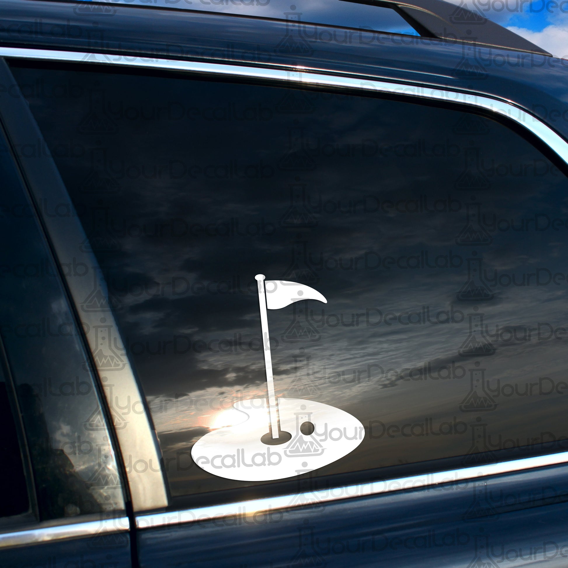 a car with a sticker of a golf ball and a flag