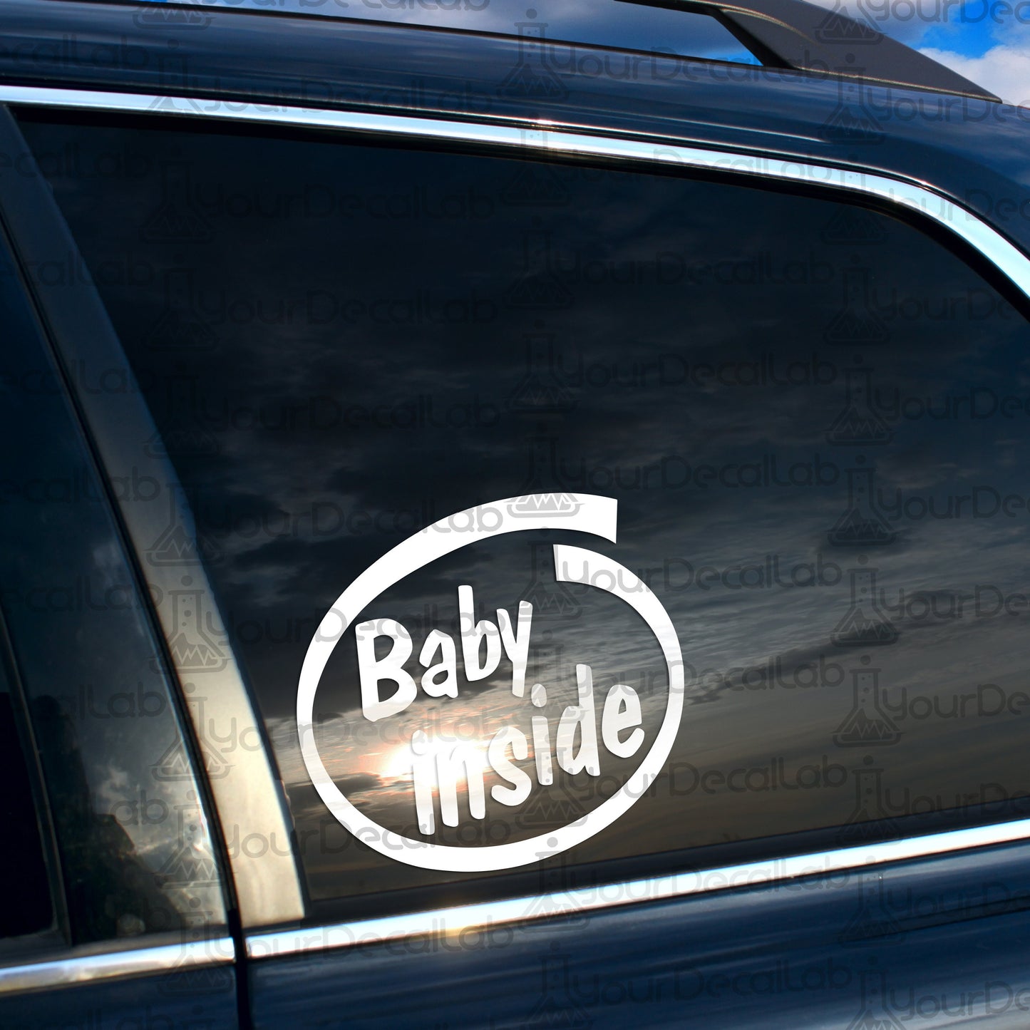 a baby inside sticker on the side of a car