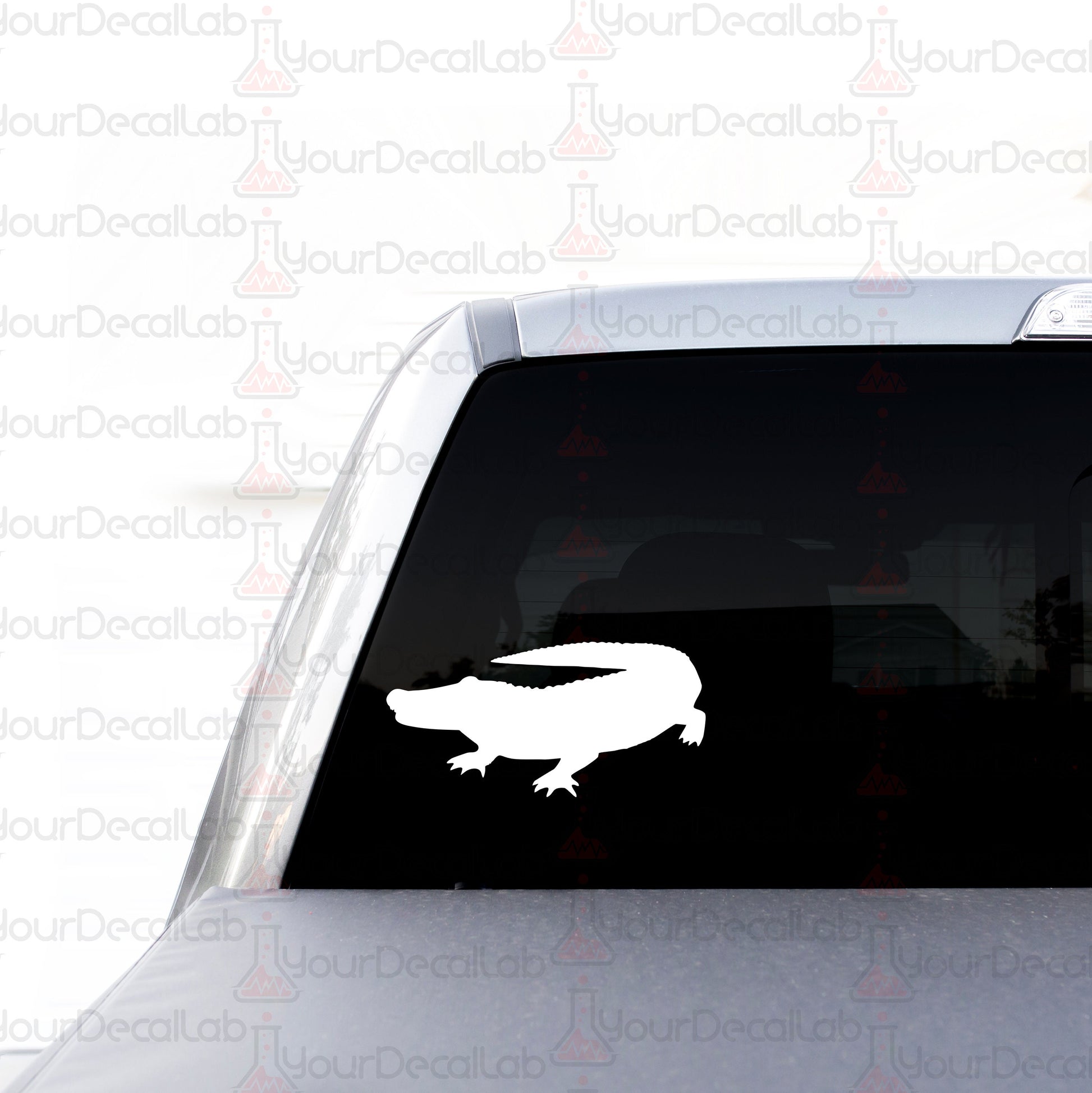 a sticker of a crocodile on the back of a car