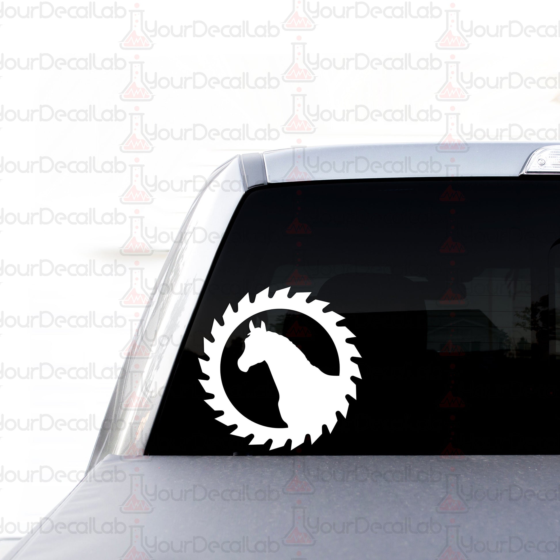 a sticker of a horse in a circle on the back of a car