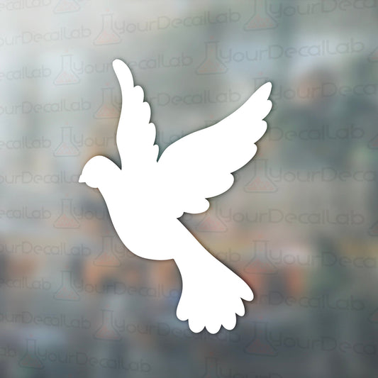 a white bird flying through the air with a blurry background
