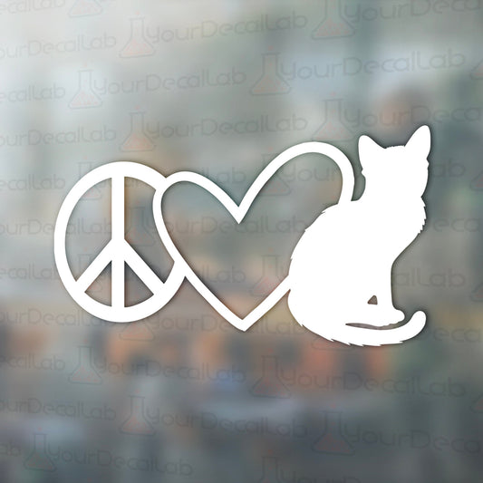 a cat and a peace sign on a window