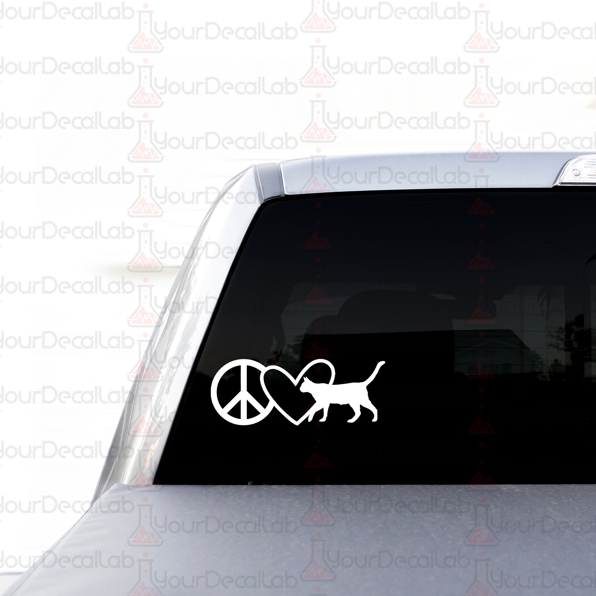 a car with a sticker of a cat and a peace sign