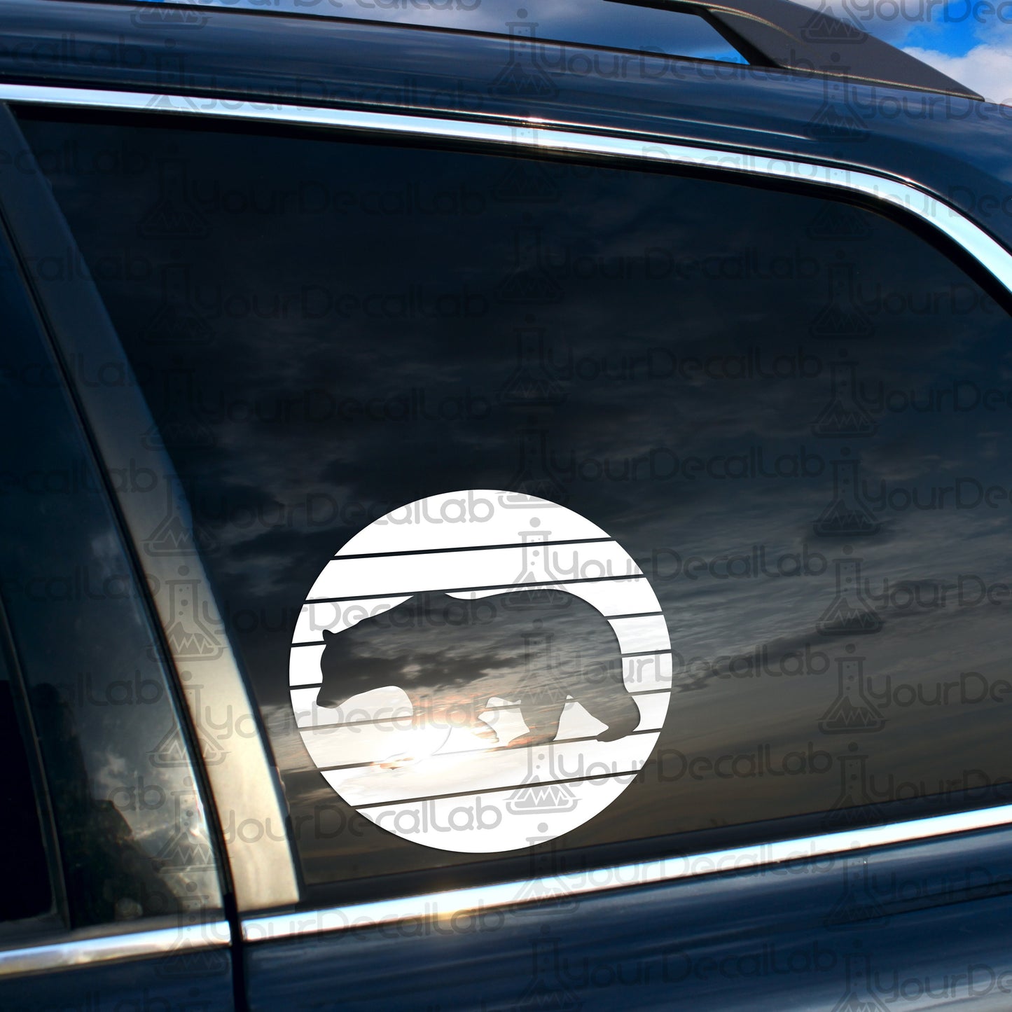 a bear sticker on the side of a car