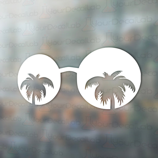 a pair of sunglasses with palm trees on them