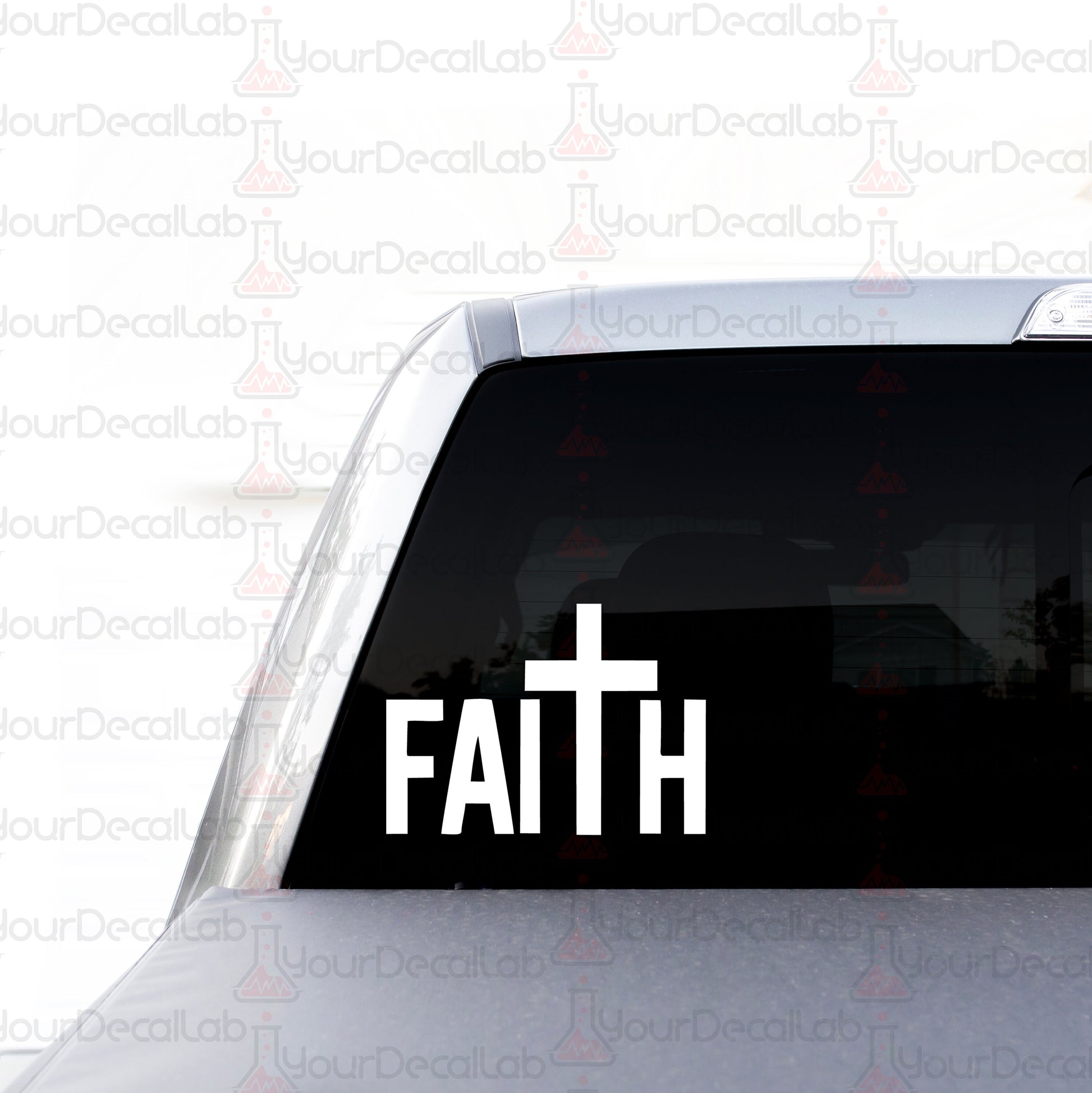 a white sticker with the word faith on it